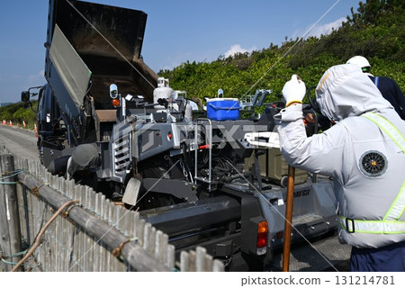 A scene of asphalt paving work on a road A scene of asphalt paving work on a road 131214781
