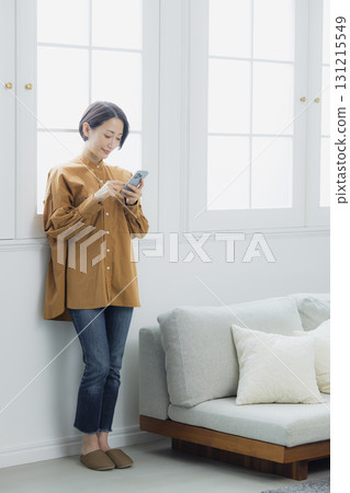 Woman holding a smartphone 131215549