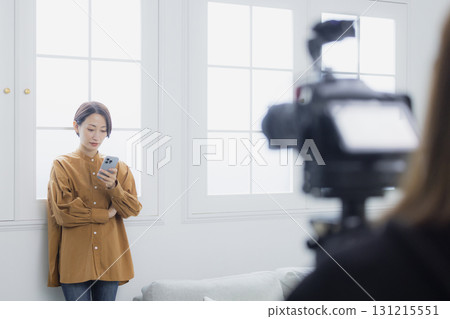 Woman holding a smartphone Woman holding a smartphone 131215551