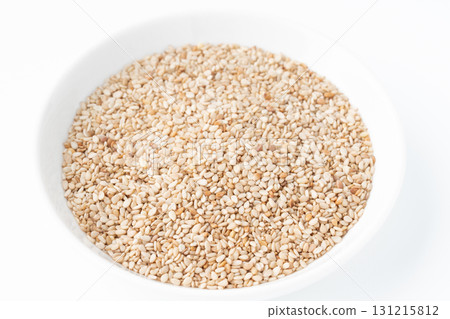 White sesame seeds (raw sesame seeds) in a plate on a white background White sesame seeds (raw sesame seeds) in a plate on a white background 131215812