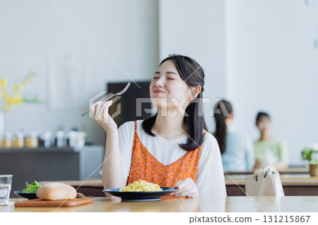 Young woman having lunch at a cafe Young woman having lunch at a cafe 131215867