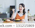 Young woman having lunch at a cafe 131215869