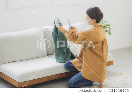 A woman selling items on a flea market app 131216103