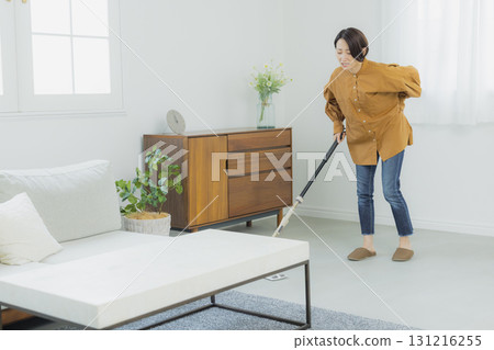 Middle-aged woman cleaning the floor 131216255