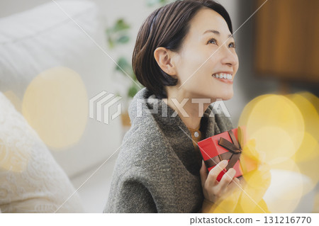 Middle women with gifts 131216770