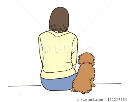 Rear view of a young woman sitting with her pet dog 131217584