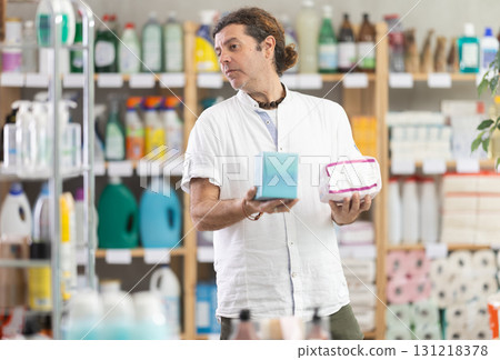 Man view trademark sign on label, chooses eco friendly panty liners Man view trademark sign on label, chooses eco friendly panty liners 131218378