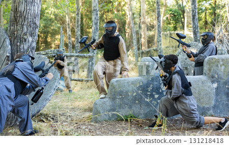 Tactical paintball players training on battlefield Tactical paintball players training on battlefield 131218418