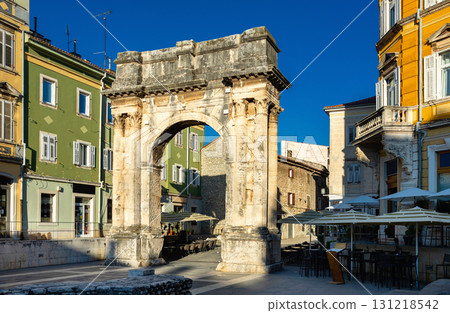 Ancient Arch of Sergii blending with Pula old town street life 131218542