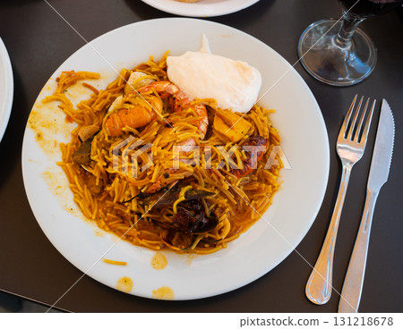 Pasta with seafood contains tiger prawns, shell mussels, spices and white sauce Pasta with seafood contains tiger prawns, shell mussels, spices and white sauce 131218678