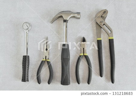 Tools on mortar background Tools on mortar background 131218683