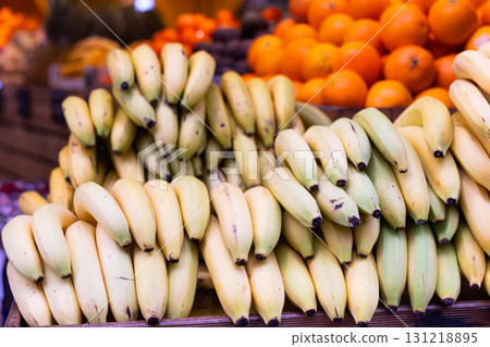 Stand of bananas in greengrocery 131218895