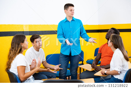 Men and women chatting in conversation club Men and women chatting in conversation club 131218922