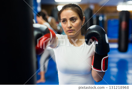 Woman in boxing gloves Woman in boxing gloves 131218968