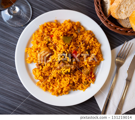 Meat and chicken paella - de montanya. Spanish dish Meat and chicken paella - de montanya. Spanish dish 131219014