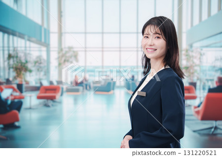 Young female staff serving custodian at the airport 131220521