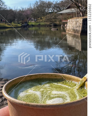 Enjoy a Serene Matcha Moment by the Water, embracing the beauty of nature and tranquility 131220802