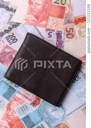 Cash paper money of Brazil, notes as a conceptual background of investment, savings Cash paper money of Brazil, notes as a conceptual background of investment, savings 131221109
