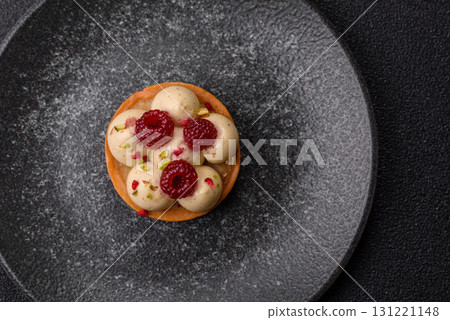 Sweet cake or tart round with cream and raspberries. Raspberry sweet tart 131221148