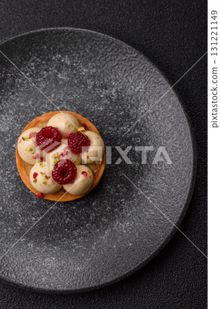 Sweet cake or tart round with cream and raspberries. Raspberry sweet tart Sweet cake or tart round with cream and raspberries. Raspberry sweet tart 131221149