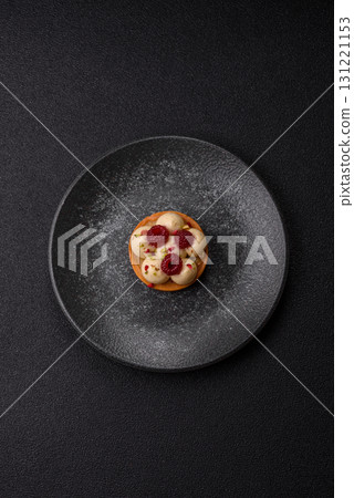Sweet cake or tart round with cream and raspberries. Raspberry sweet tart 131221153