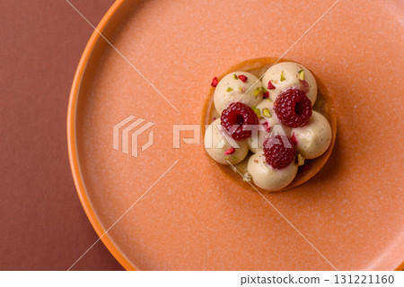 Sweet cake or tart round with cream and raspberries. Raspberry sweet tart 131221160