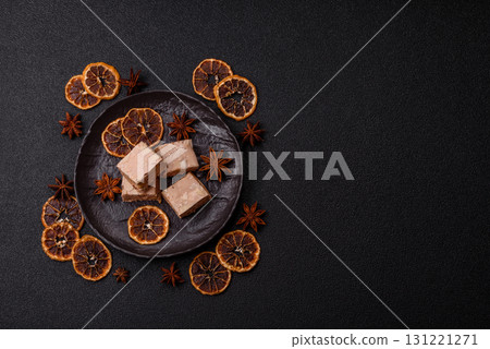 Nougat or white caramel with hazelnuts and pistachios and citrus pieces. White nougat with nuts 131221271