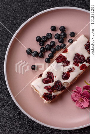 Nougat or white caramel with hazelnuts and pistachios and citrus pieces. White nougat with nuts Nougat or white caramel with hazelnuts and pistachios and citrus pieces. White nougat with nuts 131221295