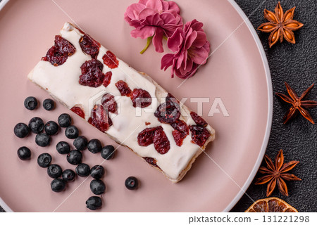 Nougat or white caramel with hazelnuts and pistachios and citrus pieces. White nougat with nuts Nougat or white caramel with hazelnuts and pistachios and citrus pieces. White nougat with nuts 131221298