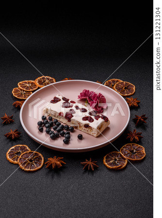 Nougat or white caramel with hazelnuts and pistachios and citrus pieces. White nougat with nuts Nougat or white caramel with hazelnuts and pistachios and citrus pieces. White nougat with nuts 131221304