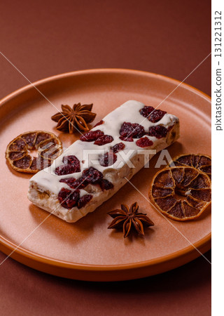 Nougat or white caramel with hazelnuts and pistachios and citrus pieces. White nougat with nuts Nougat or white caramel with hazelnuts and pistachios and citrus pieces. White nougat with nuts 131221312