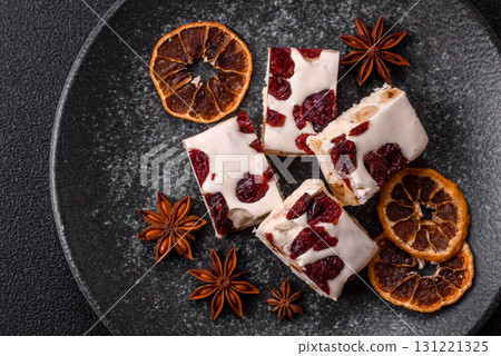 Nougat or white caramel with hazelnuts and pistachios and citrus pieces. White nougat with nuts Nougat or white caramel with hazelnuts and pistachios and citrus pieces. White nougat with nuts 131221325