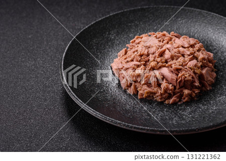 Tuna, canned fish in a can and on a plate for making sandwiches and other food. Canned tuna Tuna, canned fish in a can and on a plate for making sandwiches and other food. Canned tuna 131221362