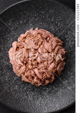 Tuna, canned fish in a can and on a plate for making sandwiches and other food. Canned tuna Tuna, canned fish in a can and on a plate for making sandwiches and other food. Canned tuna 131221364