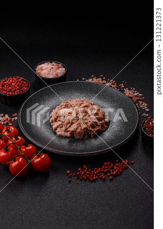 Tuna, canned fish in a can and on a plate for making sandwiches and other food. Canned tuna Tuna, canned fish in a can and on a plate for making sandwiches and other food. Canned tuna 131221373
