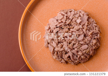 Tuna, canned fish in a can and on a plate for making sandwiches and other food. Canned tuna Tuna, canned fish in a can and on a plate for making sandwiches and other food. Canned tuna 131221379