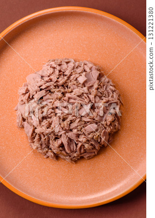 Tuna, canned fish in a can and on a plate for making sandwiches and other food. Canned tuna Tuna, canned fish in a can and on a plate for making sandwiches and other food. Canned tuna 131221380