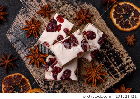 Nougat or white caramel with hazelnuts and pistachios and citrus pieces. White nougat with nuts 131221421