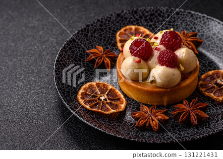 Sweet cake or tart round with cream and raspberries. Raspberry sweet tart Sweet cake or tart round with cream and raspberries. Raspberry sweet tart 131221431
