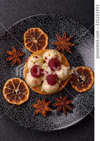 Sweet cake or tart round with cream and raspberries. Raspberry sweet tart 131221433