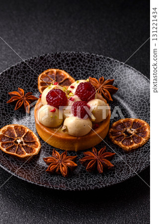 Sweet cake or tart round with cream and raspberries. Raspberry sweet tart 131221434