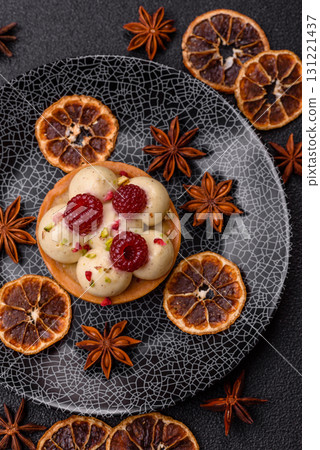 Sweet cake or tart round with cream and raspberries. Raspberry sweet tart 131221437