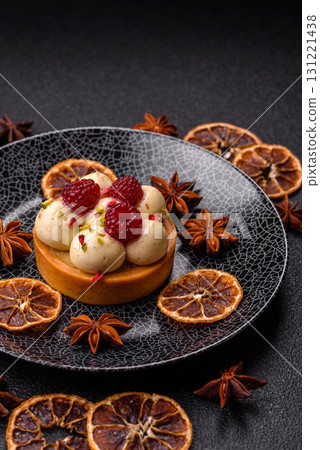 Sweet cake or tart round with cream and raspberries. Raspberry sweet tart 131221438