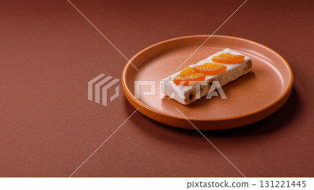 Nougat or white caramel with hazelnuts and pistachios and citrus pieces. White nougat with nuts 131221445