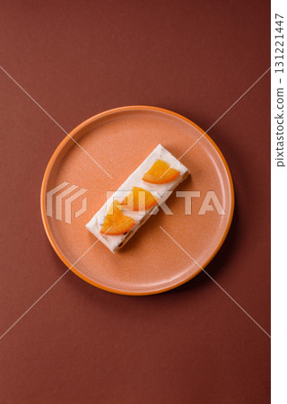 Nougat or white caramel with hazelnuts and pistachios and citrus pieces. White nougat with nuts 131221447