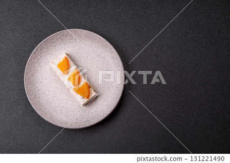 Nougat or white caramel with hazelnuts and pistachios and citrus pieces. White nougat with nuts Nougat or white caramel with hazelnuts and pistachios and citrus pieces. White nougat with nuts 131221490