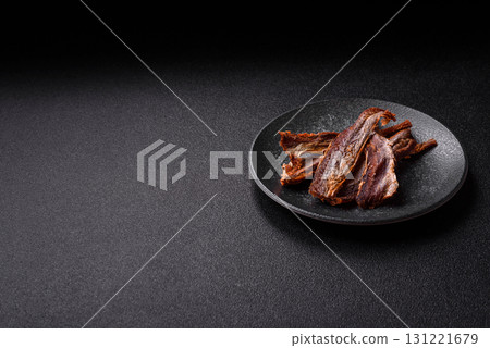 Dried salted fish as snacks or jerky, seafood as slices. Dried seafood snacks Dried salted fish as snacks or jerky, seafood as slices. Dried seafood snacks 131221679