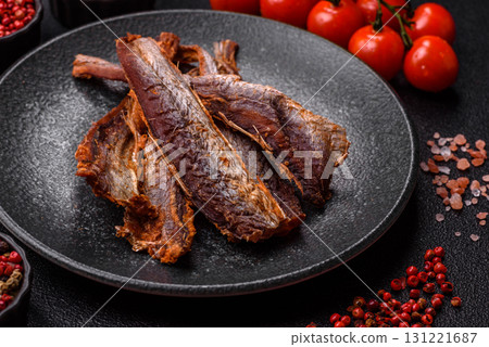 Dried salted fish as snacks or jerky, seafood as slices. Dried seafood snacks Dried salted fish as snacks or jerky, seafood as slices. Dried seafood snacks 131221687