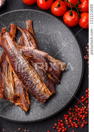 Dried salted fish as snacks or jerky, seafood as slices. Dried seafood snacks Dried salted fish as snacks or jerky, seafood as slices. Dried seafood snacks 131221689