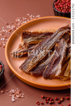 Dried salted fish as snacks or jerky, seafood as slices. Dried seafood snacks Dried salted fish as snacks or jerky, seafood as slices. Dried seafood snacks 131221702